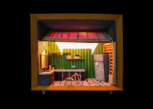 a doll house showing a kitchen scene