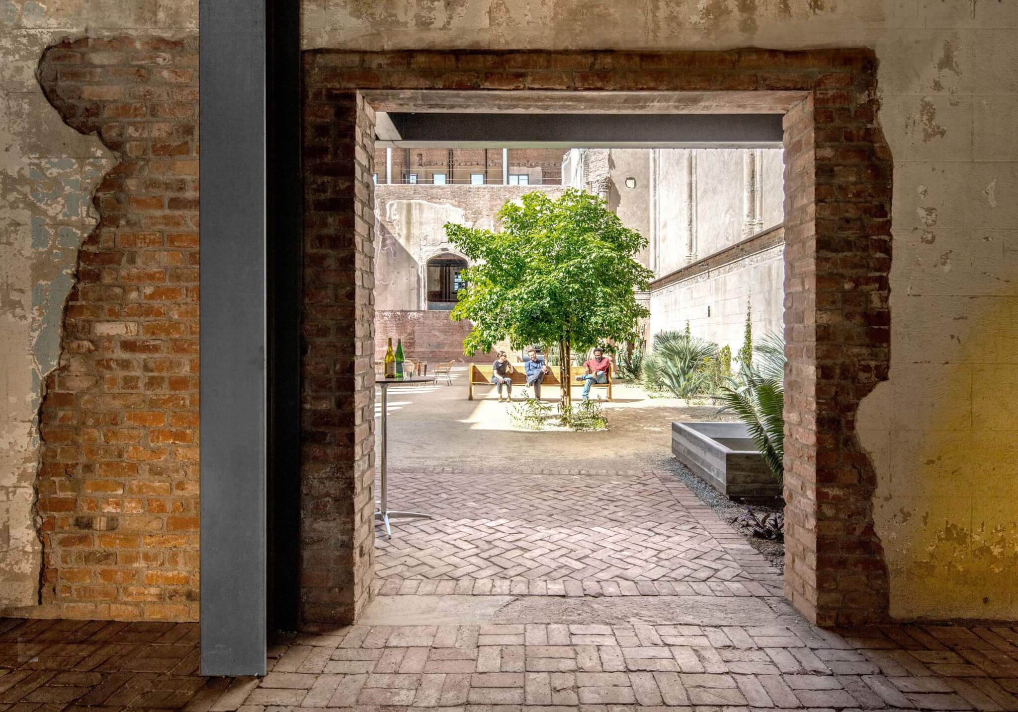 a courtyard at the center of the former church