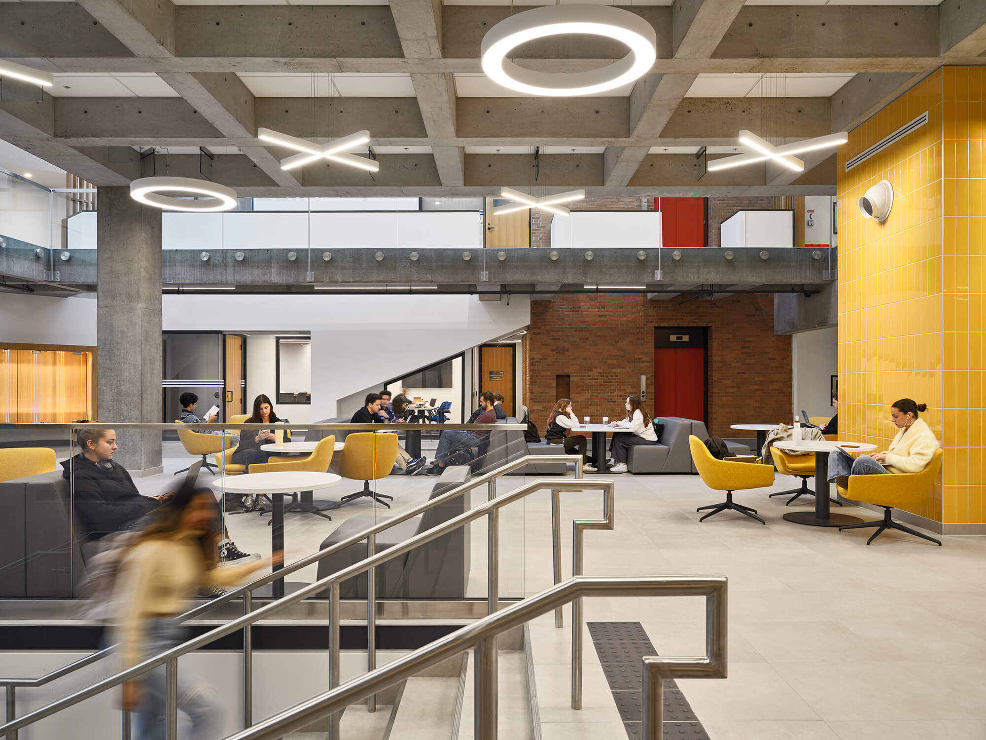 interiors of university of windsor law building with concrete ceiling and new furniture for studying