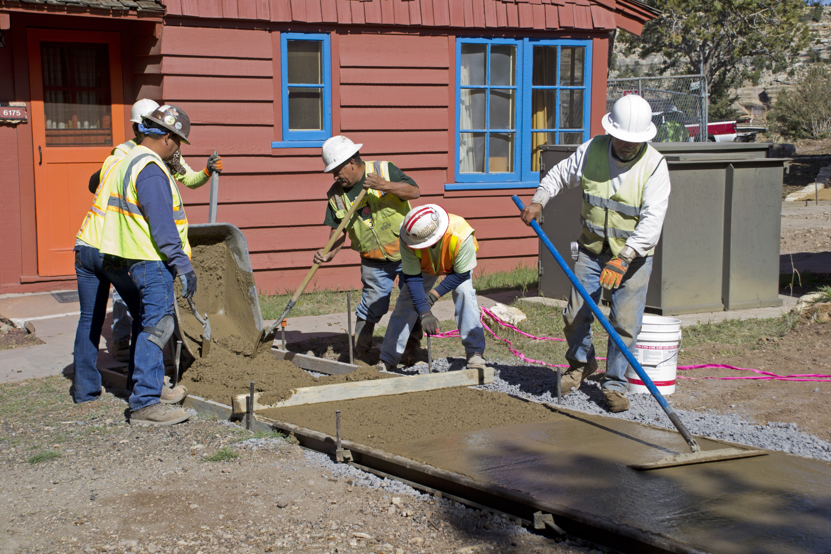 construction workers building sidewalk