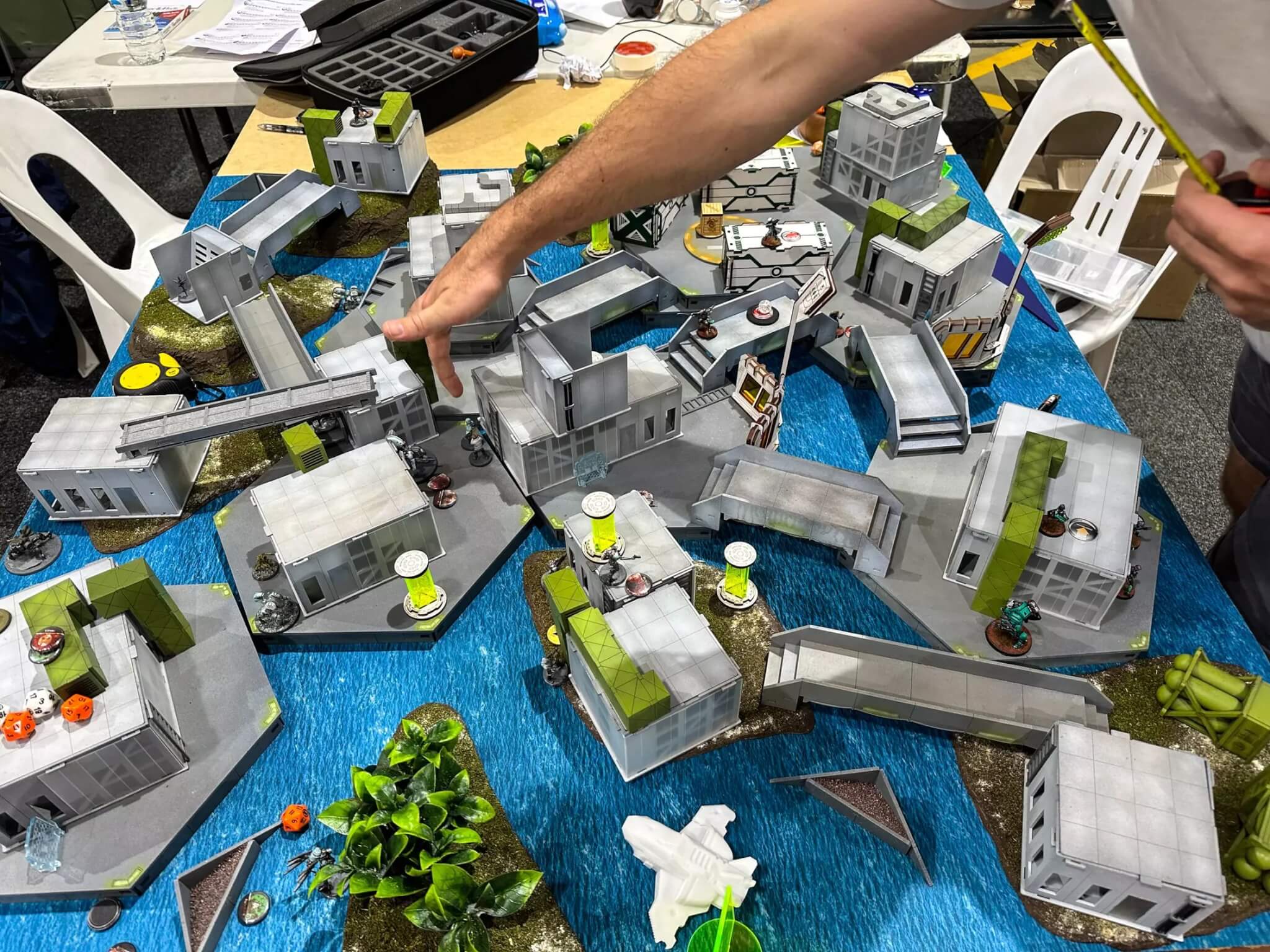 hands setting up tabletop wargaming
