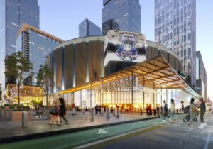 rendering of a train station exterior with surrounding skyscrapers